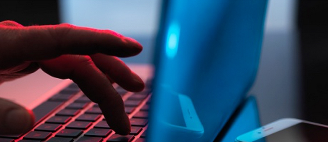 hand typing on laptop