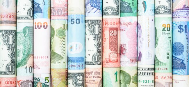 A backgrounds with colorful of many roll currency from many country