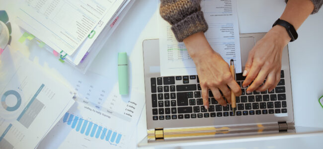 accountant woman with documents and laptop working