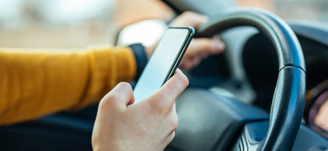 using mobile phone while driving the car.